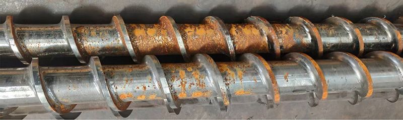 Corroded twin screw shaft with rust and surface damage