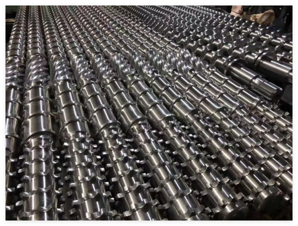 Finished extrusion screws in a factory