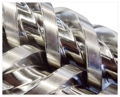Bimetallic extrusion screw with hardwood flight lands for high-wear duty